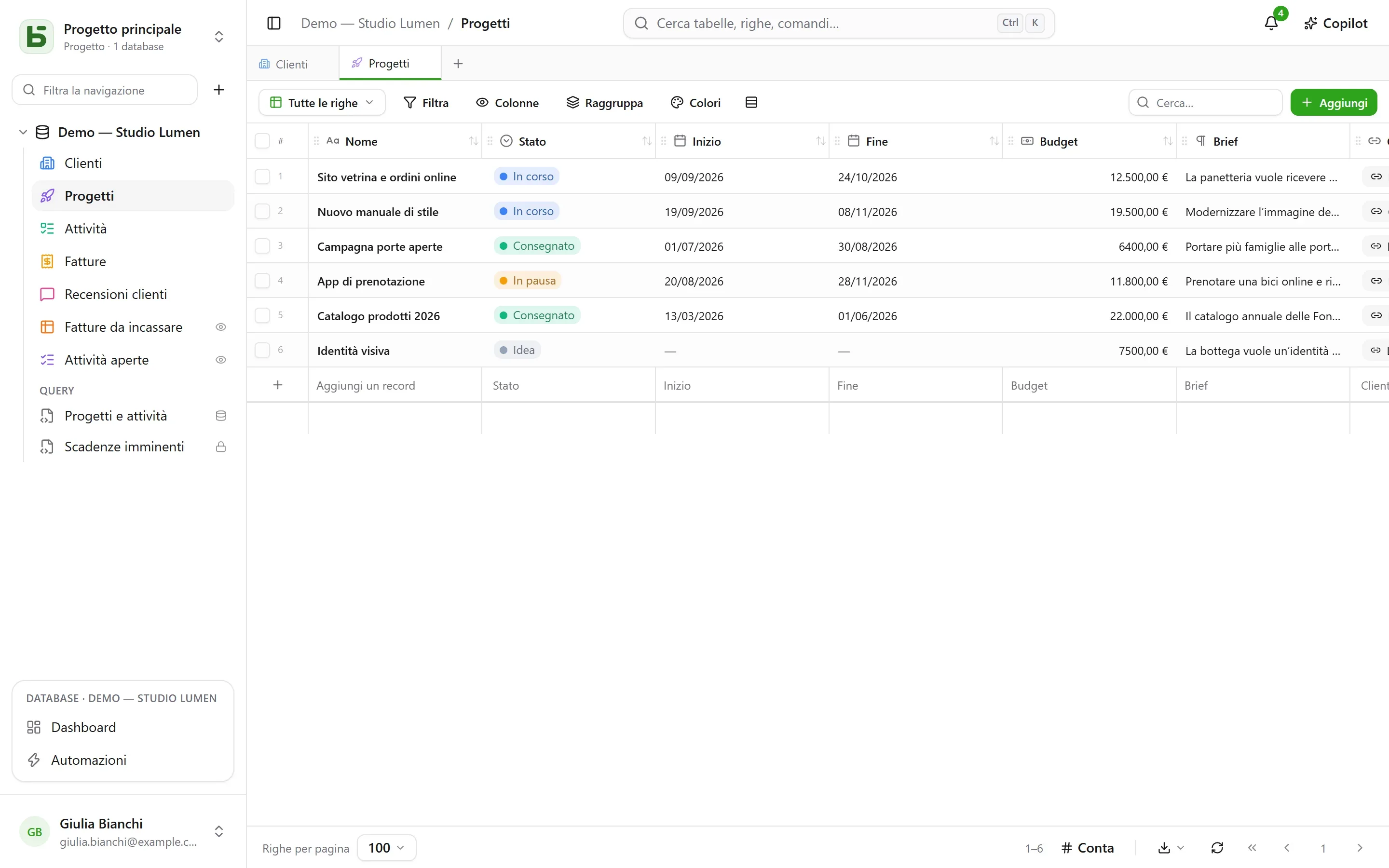 basedb — griglia: Una griglia che scrive in una vera tabella — e campi calcolati: una durata con una formula, la città del cliente con una ricerca, il numero di attività con un conteggio.